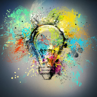 Concept of a new creative idea with drawn and colored bulb with bright colors